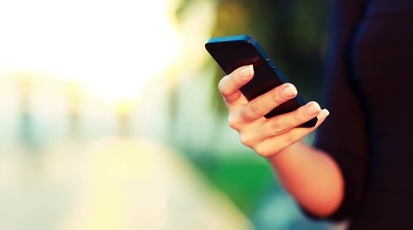 female hand using a cell phone