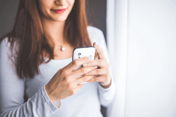 Woman texting on mobile phone