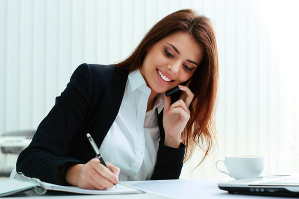 businesswoman smiling on a phone call