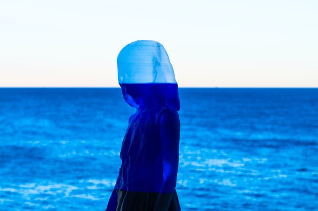 hologram woman in front of water