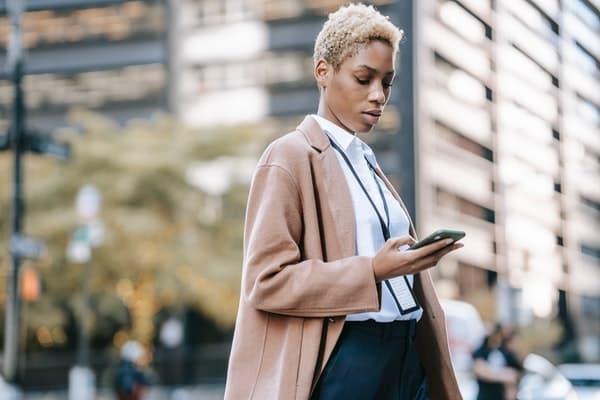 woman looking at cell phone